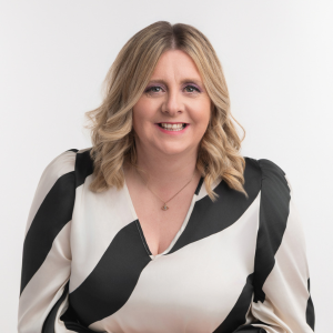 Client image taken by Shauna Kennedy of a lady with blonde hair and wearing a black and white top